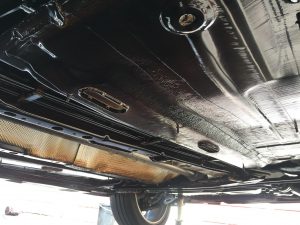 a vehicle chassis that has just been protected by a wax like coating to protect from the harsh environment 